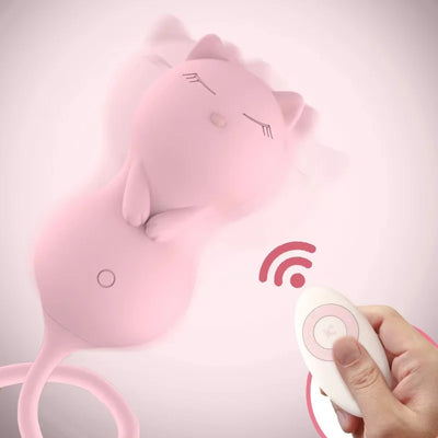 Hand holding white wireless remote while pink cat vibrator shows motion vibration waves